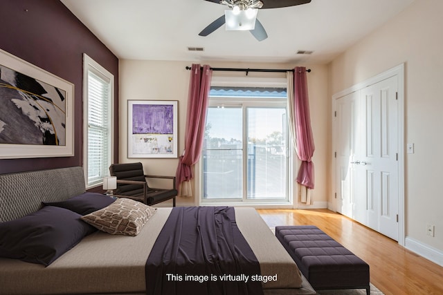 bedroom featuring light wood-type flooring and ceiling fan