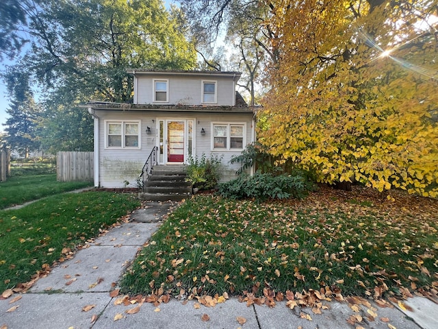 front facade with a front yard