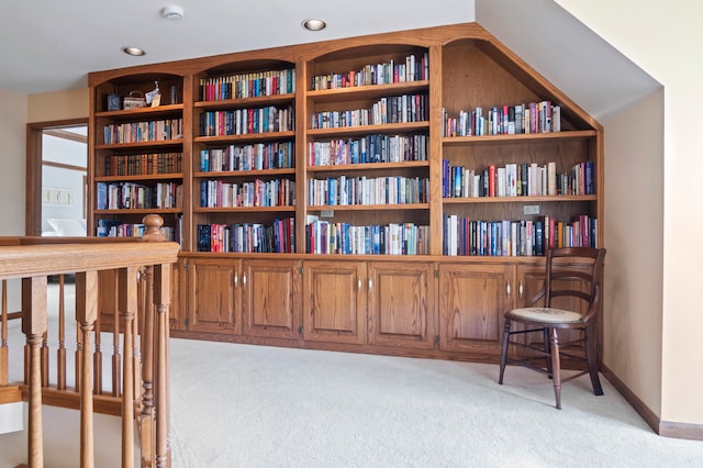 sitting room featuring light colored carpet