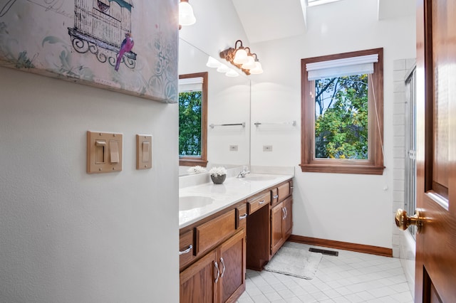 bathroom featuring vanity, an enclosed shower, and tile patterned flooring