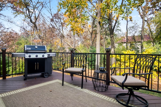 wooden deck with a grill