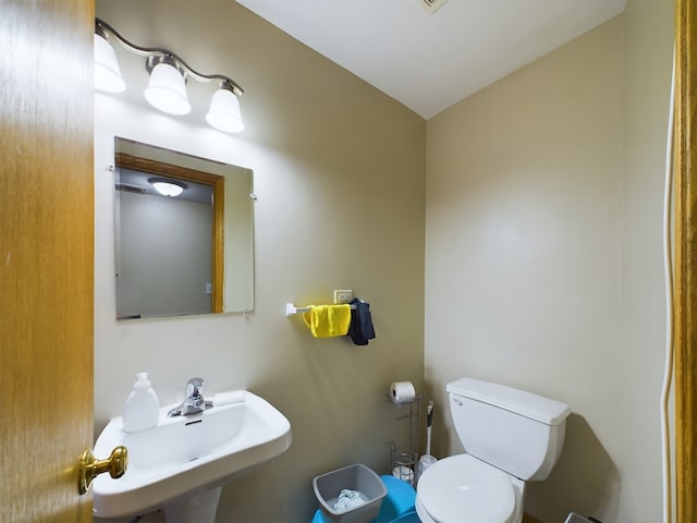 bathroom featuring sink and toilet