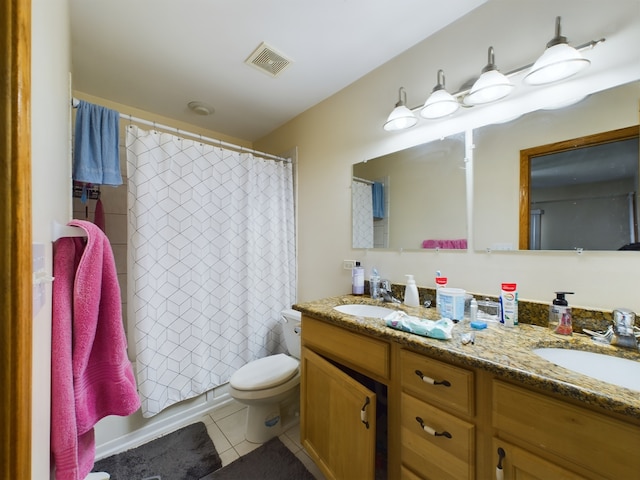 bathroom featuring toilet, vanity, tile patterned floors, and a shower with shower curtain