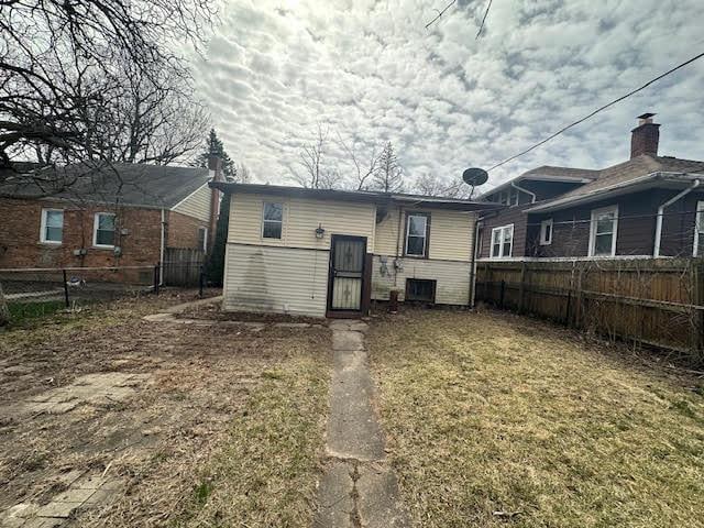 back of property with fence