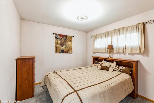 carpeted bedroom with baseboards