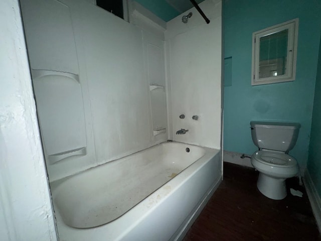 bathroom with toilet, hardwood / wood-style flooring, and  shower combination