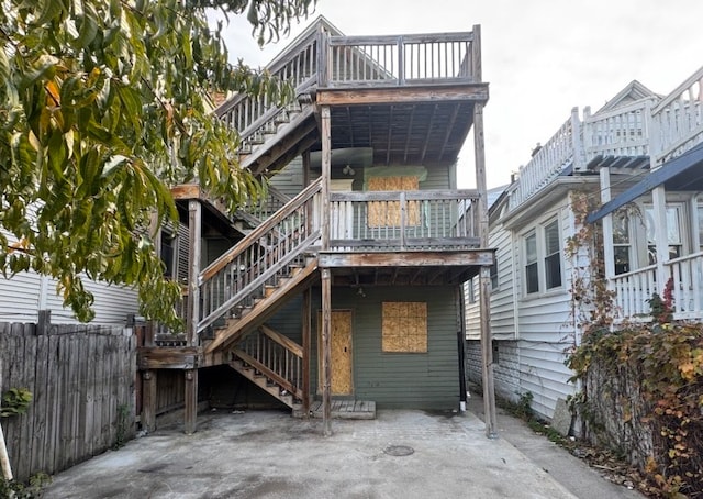 back of property with a patio area and a deck