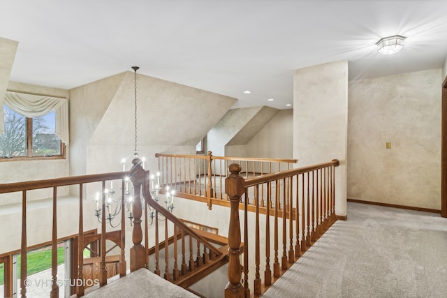 stairs with carpet floors and vaulted ceiling