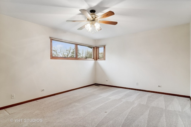 carpeted empty room with ceiling fan