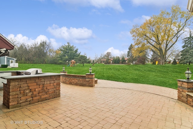 view of patio featuring area for grilling and grilling area