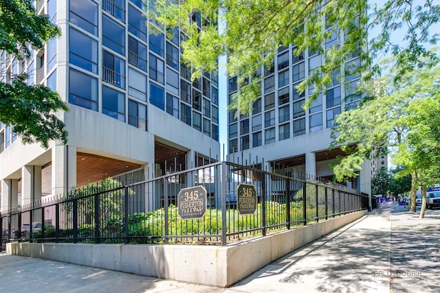 view of building exterior featuring fence