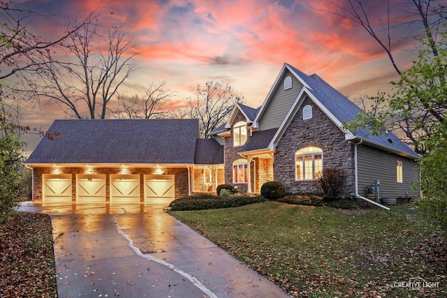 view of front of house with a lawn and a garage