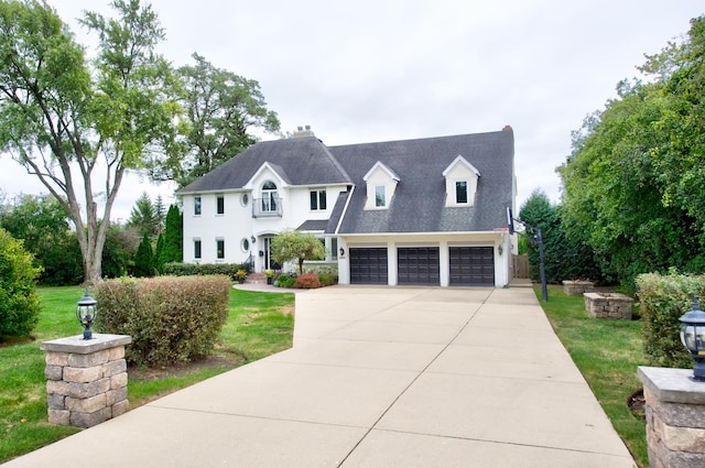 view of front of property featuring a garage and a front yard