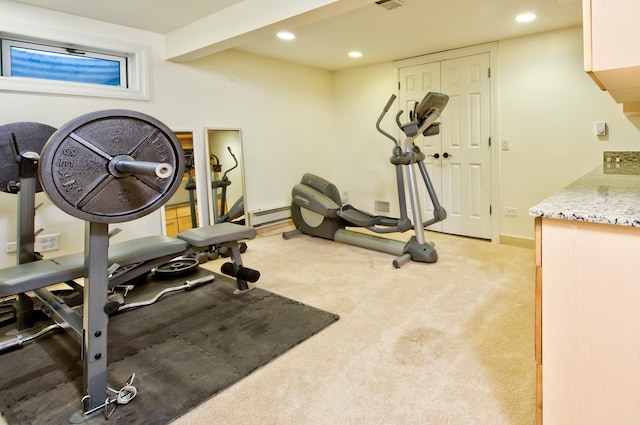 workout room featuring light colored carpet