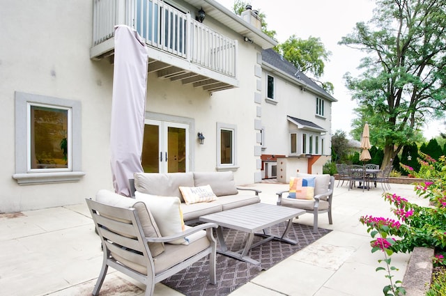 view of patio / terrace with a balcony and an outdoor living space