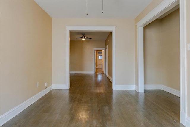 spare room featuring hardwood / wood-style flooring and ceiling fan