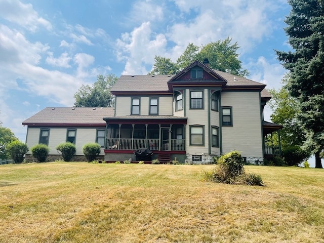 back of house with a yard