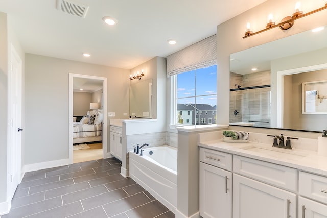 bathroom with vanity, separate shower and tub, and tile patterned flooring