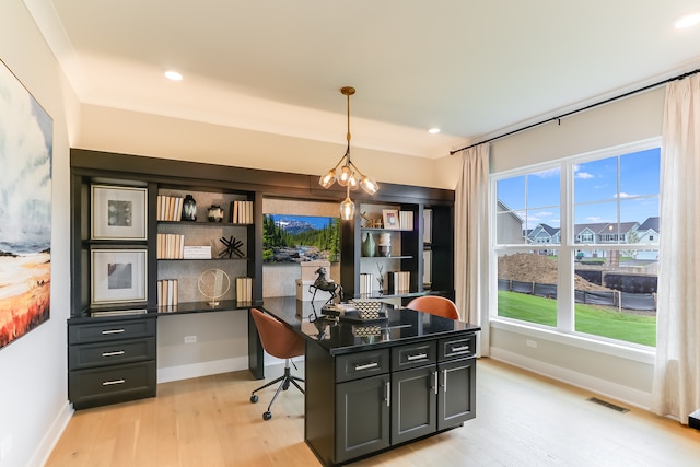 office space featuring light hardwood / wood-style floors and a notable chandelier