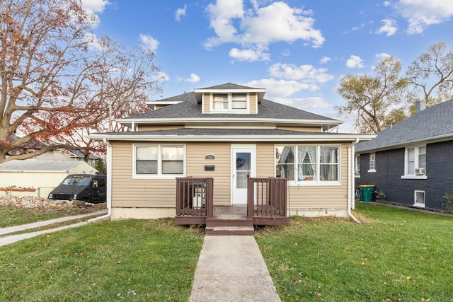 bungalow-style house with a front yard