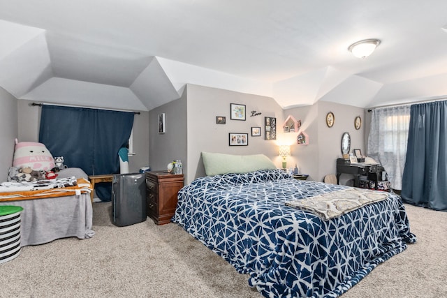 bedroom featuring carpet floors and vaulted ceiling