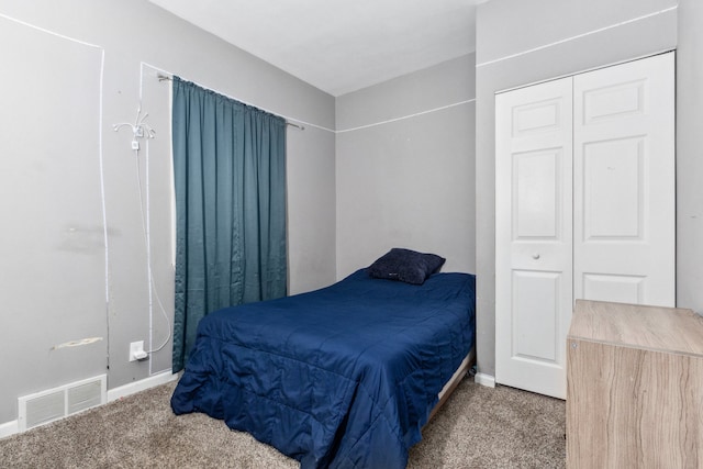 carpeted bedroom with a closet