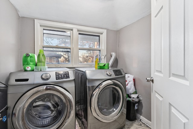 washroom with washing machine and dryer