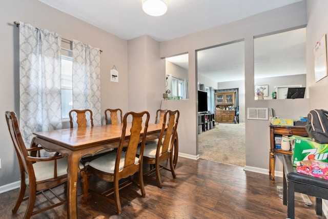 dining area featuring dark hardwood / wood-style flooring