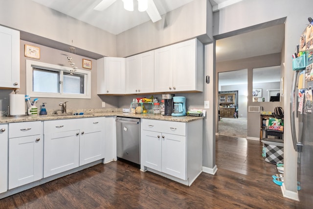 kitchen with stainless steel dishwasher, dark hardwood / wood-style floors, and white cabinets