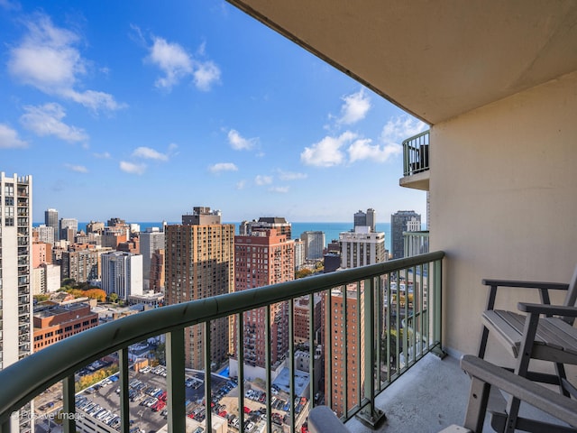 balcony featuring a water view