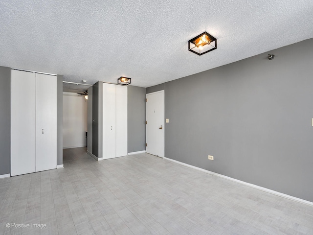 unfurnished bedroom with a textured ceiling