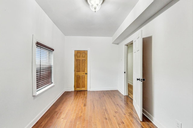 unfurnished room featuring light wood-type flooring