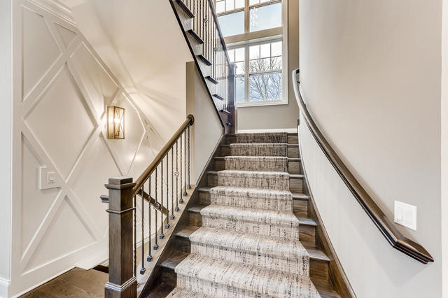 staircase featuring hardwood / wood-style flooring