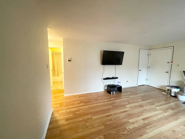 unfurnished living room featuring light hardwood / wood-style floors