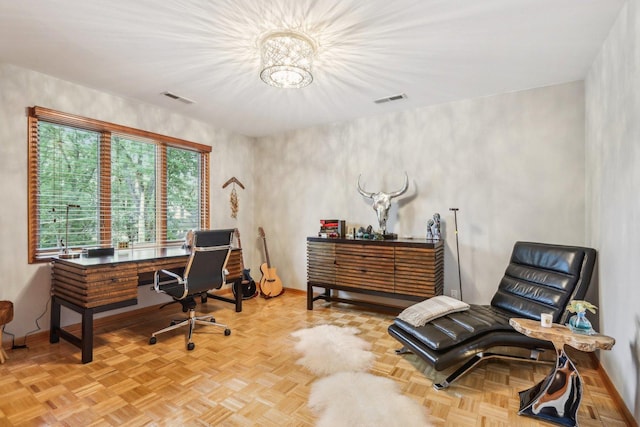 office area featuring an inviting chandelier and light parquet flooring