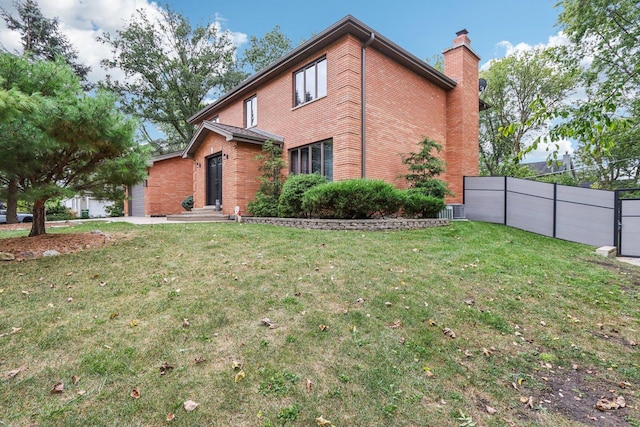 view of side of property featuring a yard