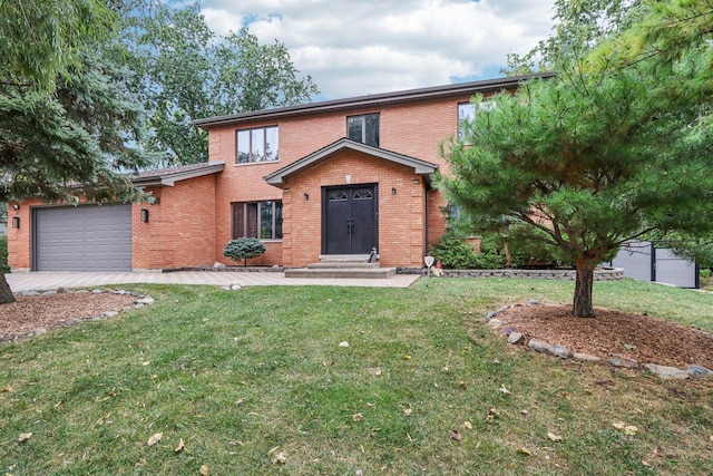 view of front of property featuring a front yard and a garage