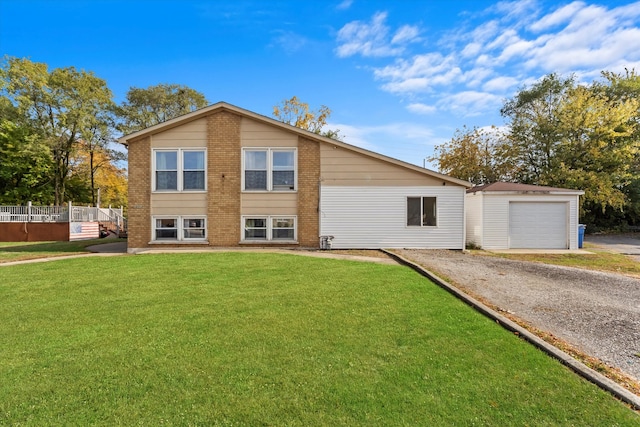 view of front facade with a front yard and a garage