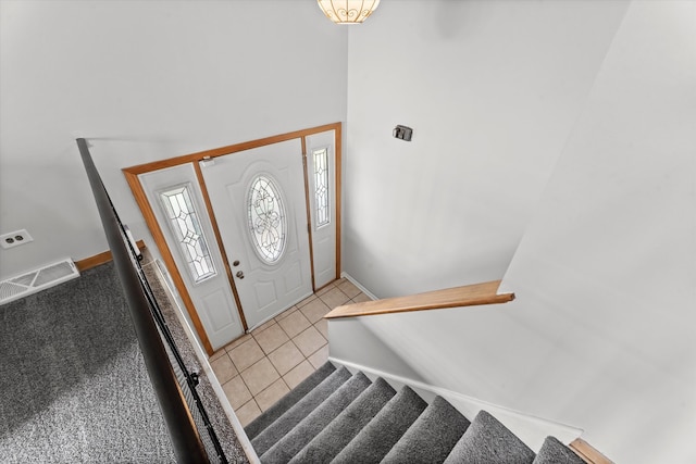 foyer entrance featuring light tile patterned floors