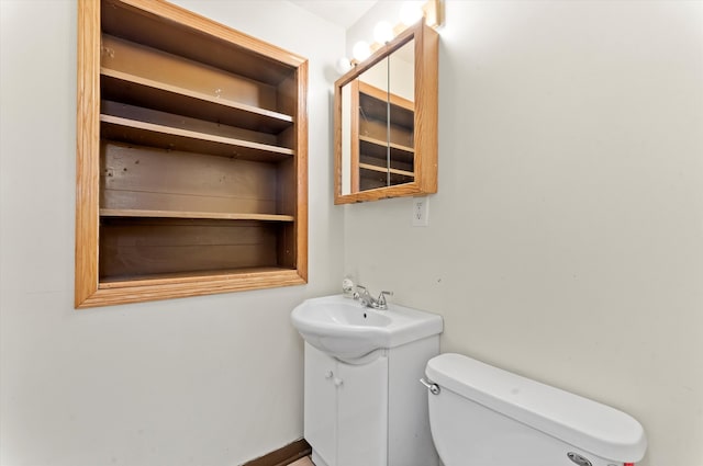 bathroom featuring toilet and sink