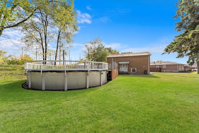 view of yard with a covered pool