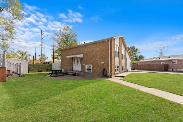 back of property featuring a lawn