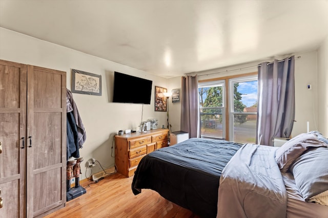 bedroom with light hardwood / wood-style flooring