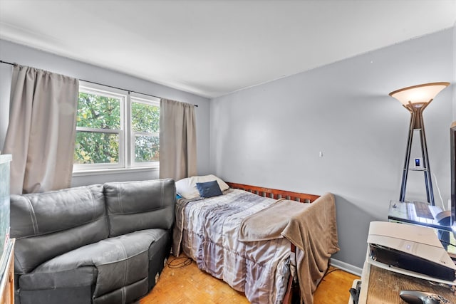 bedroom with hardwood / wood-style floors