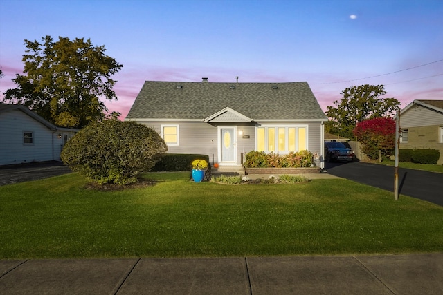 view of front of property with a yard