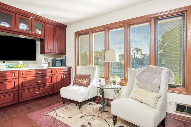 living area with dark hardwood / wood-style flooring