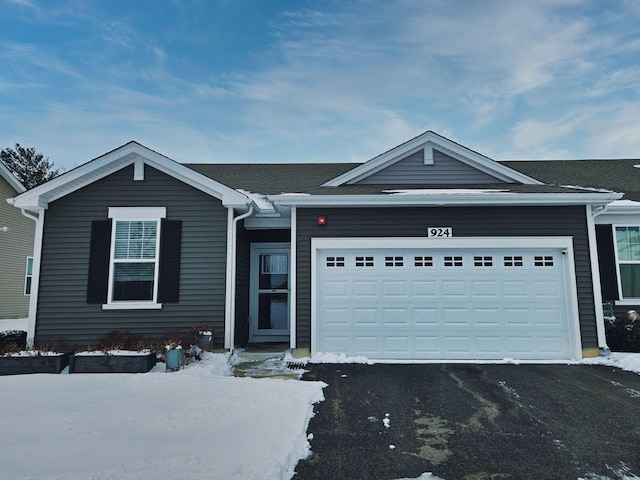 ranch-style home with a garage