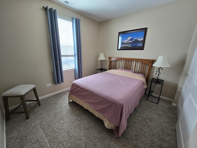 bedroom with dark carpet