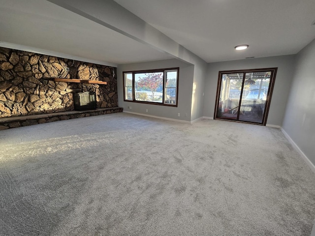 1007 River Rd, Mchenry, IL 60050 - unfurnished living room featuring baseboards, a fireplace, and carpet floors