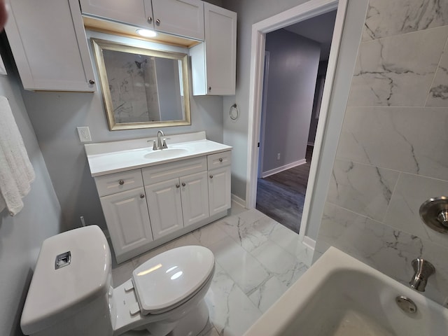 bathroom featuring vanity, toilet, and a bathing tub